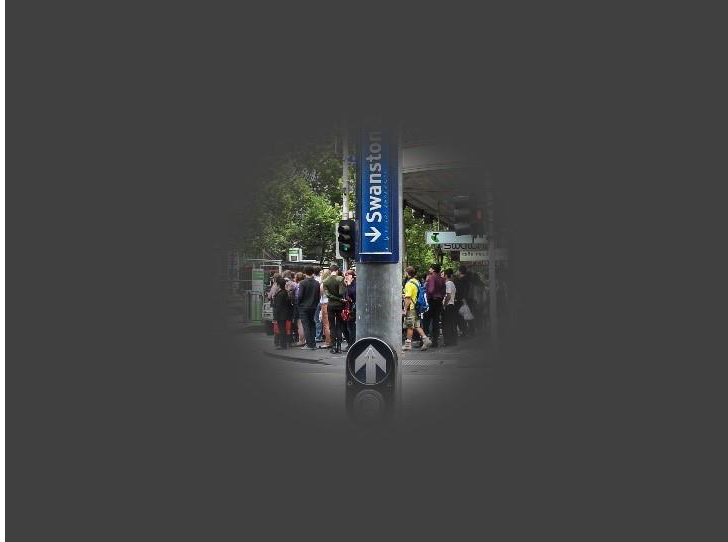 Demonstration of vision impacted by retinitis pigmentosa with a street crossing and sign on a streetscape