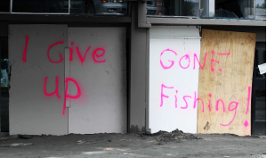 Signs on walls post disaster in Christchurch
