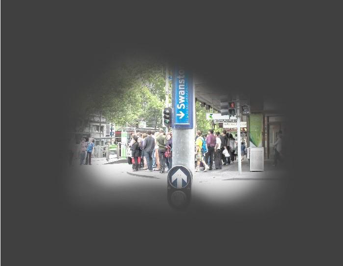 Demonstration of vision impacted by glaucoma with a street crossing and sign on a streetscape